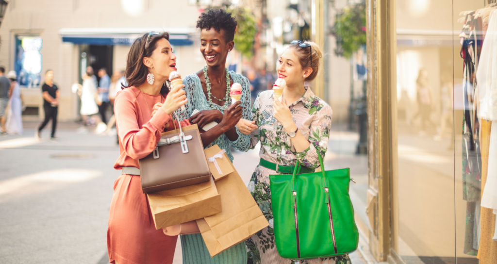 three woman eating icecreams