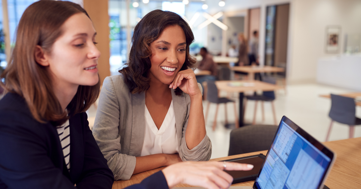 two women agreed on something that shows on the laptop