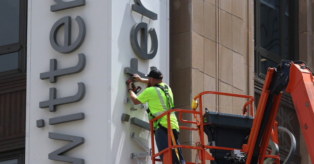 worker remove twitter from building 