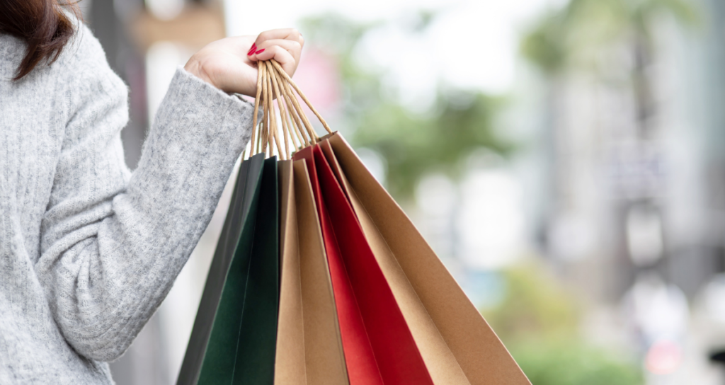 holding shopping bags