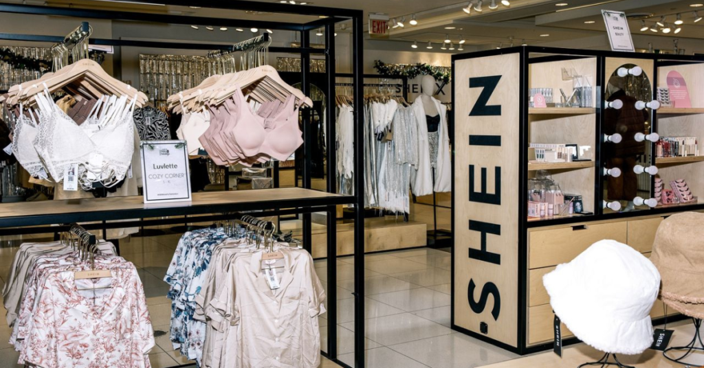 a store with clothes on swingers